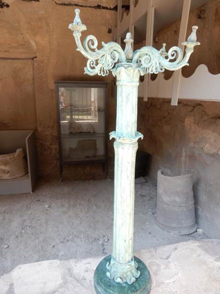 VI.12, Herculaneum. May 2018.
Reproduction bronze candelabrum with marble base, found awaiting repair in this metal worker’s workshop.
Photo courtesy of Buzz Ferebee.
